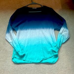 Dark blue, light blue, and white, women’s XS, v-neck.